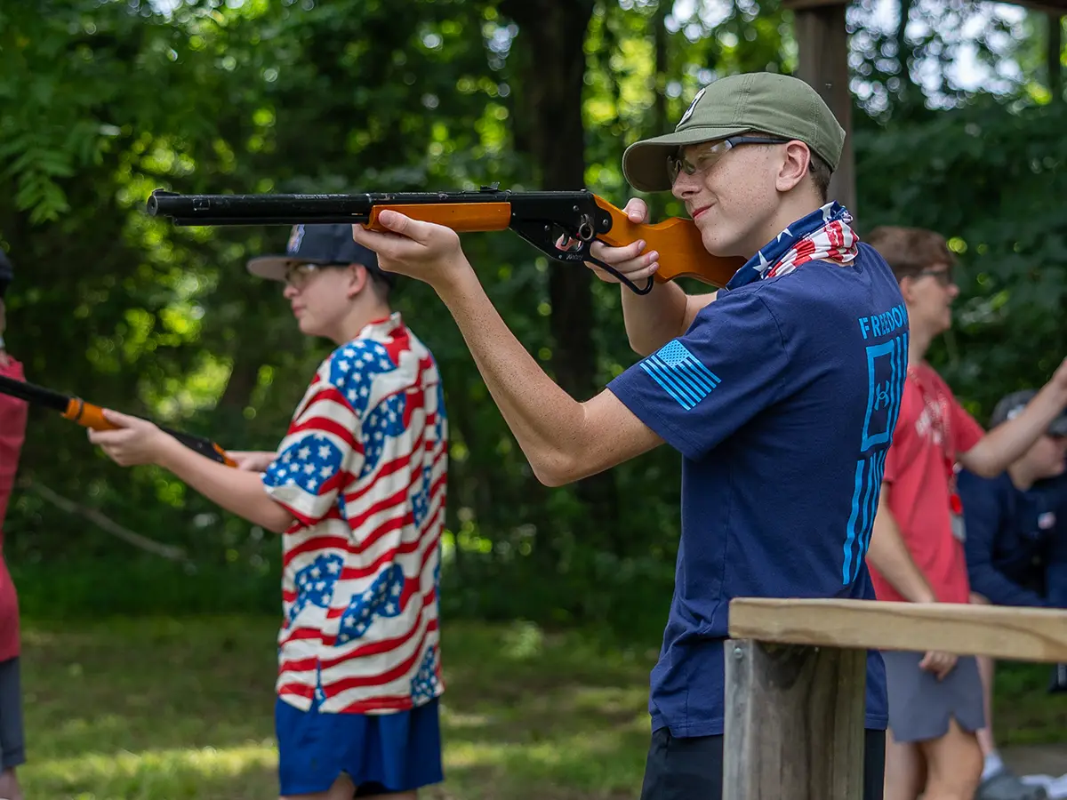 A camper at the riflery range at Brookhill Ranch